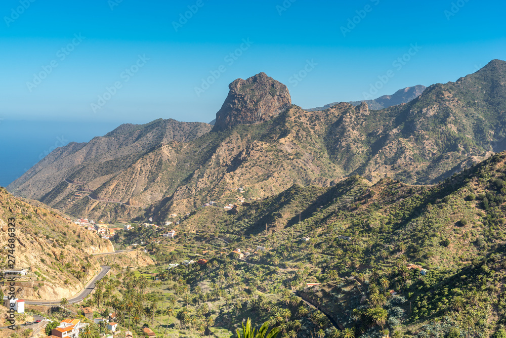 Volcanic plug in Vallehermoso what means the beautiful valley in english. View to the Roque Cano, a famous volcanic neck on the north side of La Gomera