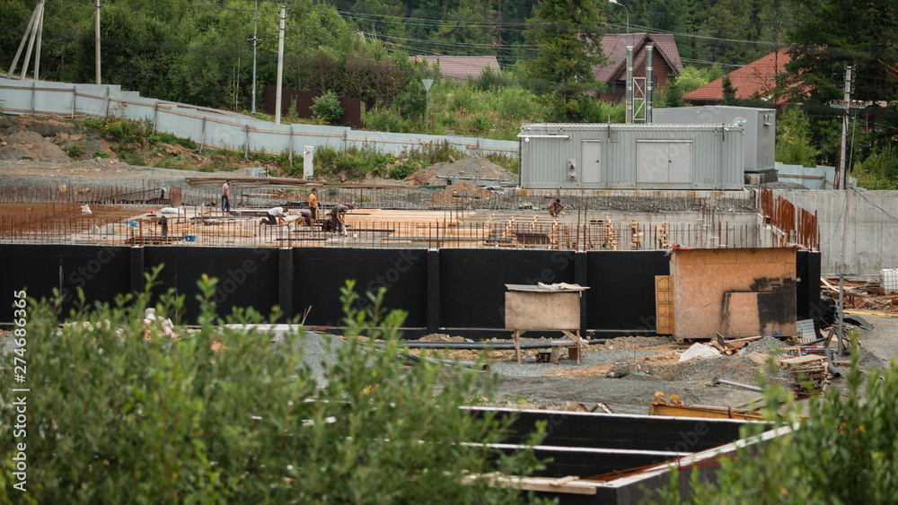 custom made wallpaper toronto digitalBuilders producing a steel reinforcing bar on a construction site. build a foundation of cement. lining the house. working people builders