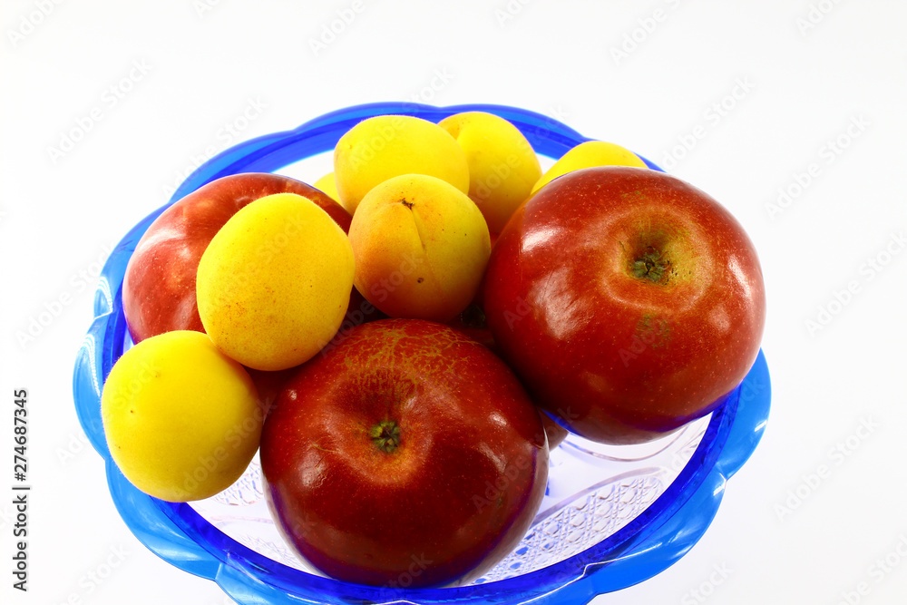 Fresh fruits are in a blue vase Fresh fruits are in a blue vase