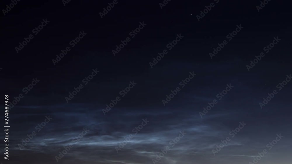 Noctilucent clouds, time lapse. Rare mesospheric clouds formed at an altitude of 85 kilometers above the ground. Noctilucent clouds, time lapse. Rare mesospheric clouds formed at an altitude of 85 kilometers above the ground.