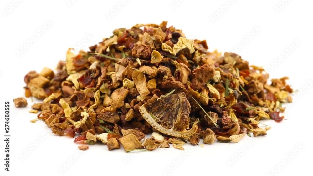 Dried fruit tea from apple, lemon and strawberry rotating over white background Dried fruit tea from apple, lemon and strawberry rotating over white background