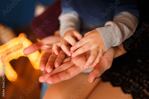 Childrens hands in the palms of the mother © Parfenova