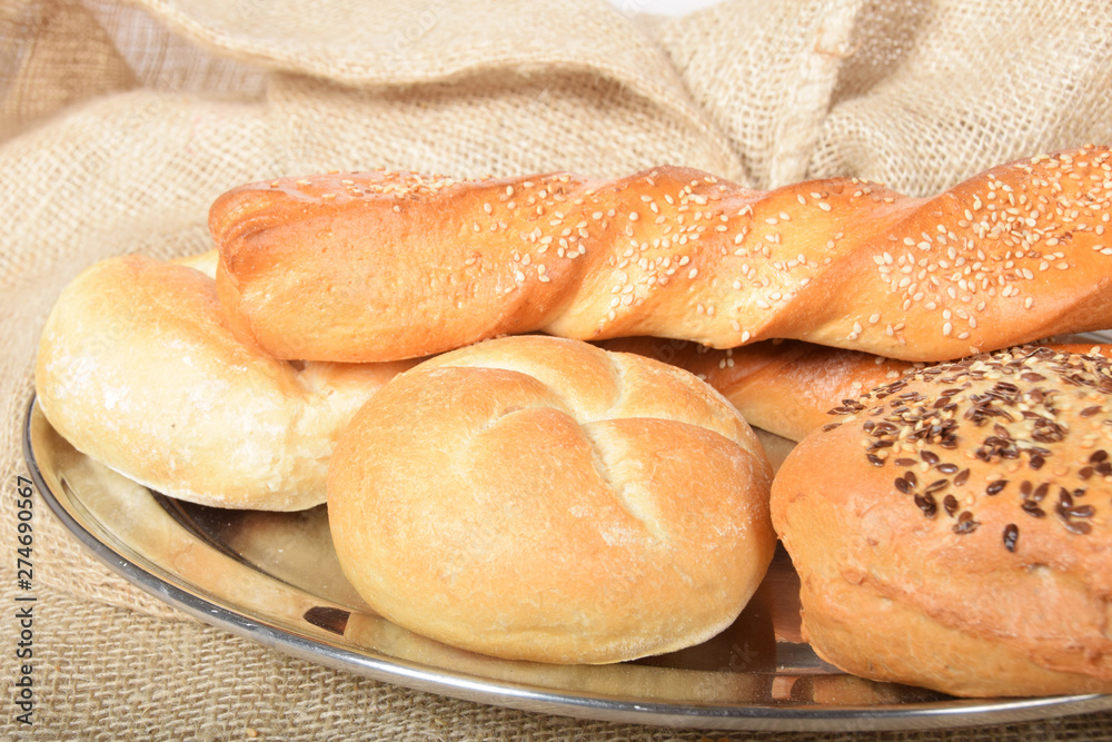 various fresh crispy baked buns with seeds