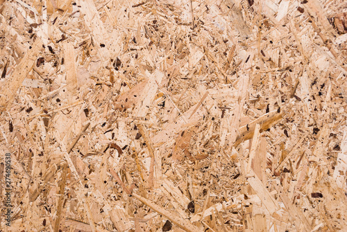 Plywood board texture.  Compressed sawdust panel background. Wood surface for interior design and decoration.