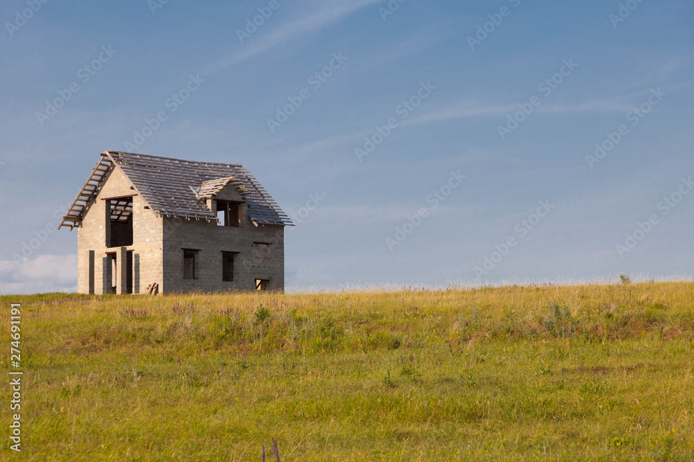 lonely unfinished house in the field lonely unfinished house in the field