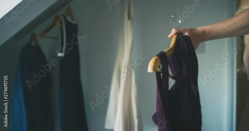 Young mother getting dressed with her toddler
