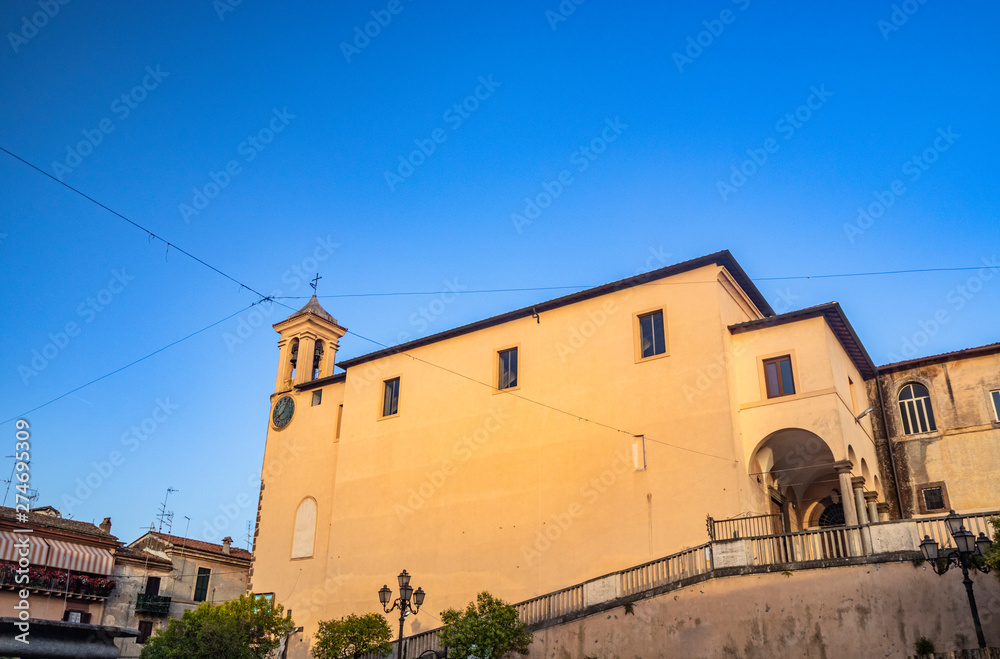 The Convent of S. Maria delle Grazie, in Santa Maria square. The bell tower with the clock. The blue sky at sunset. Zagarolo, Province of Rome, Lazio, Italy