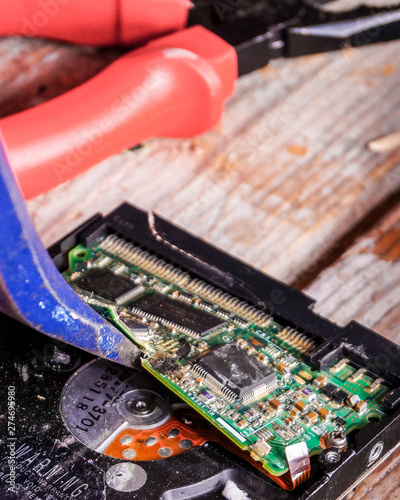 A man breaks a computer using locksmith tools.