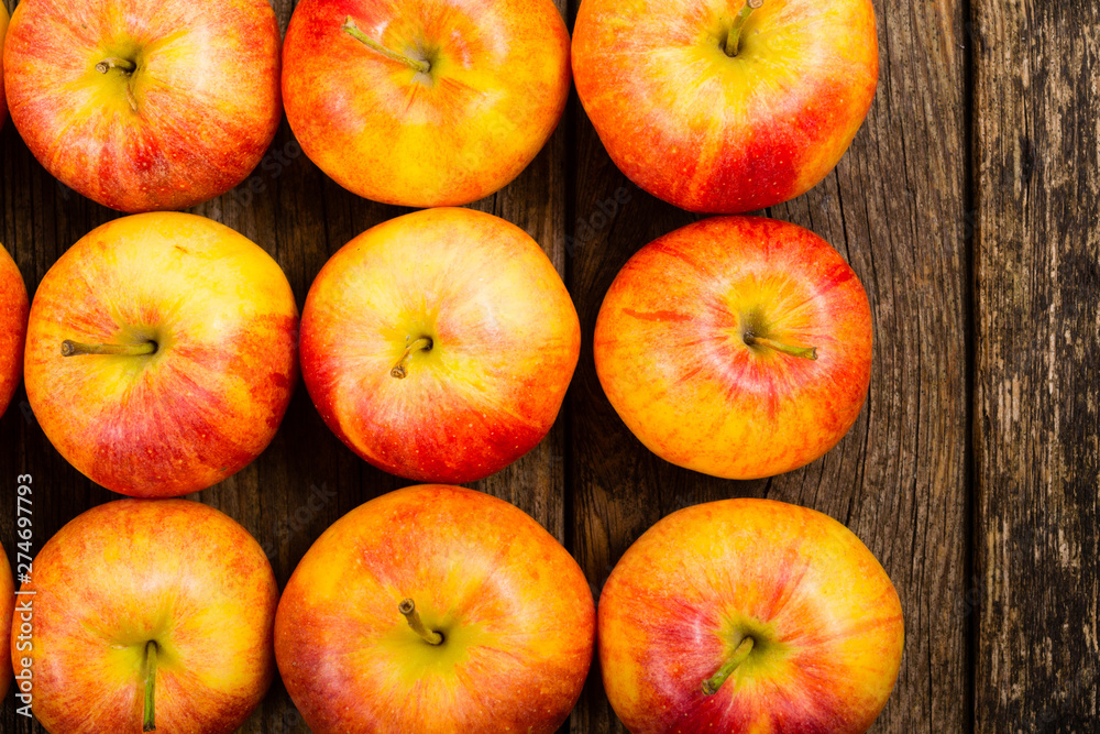 apple fruits in a row, old weathered wood table background apple fruits in a row, old weathered wood table background