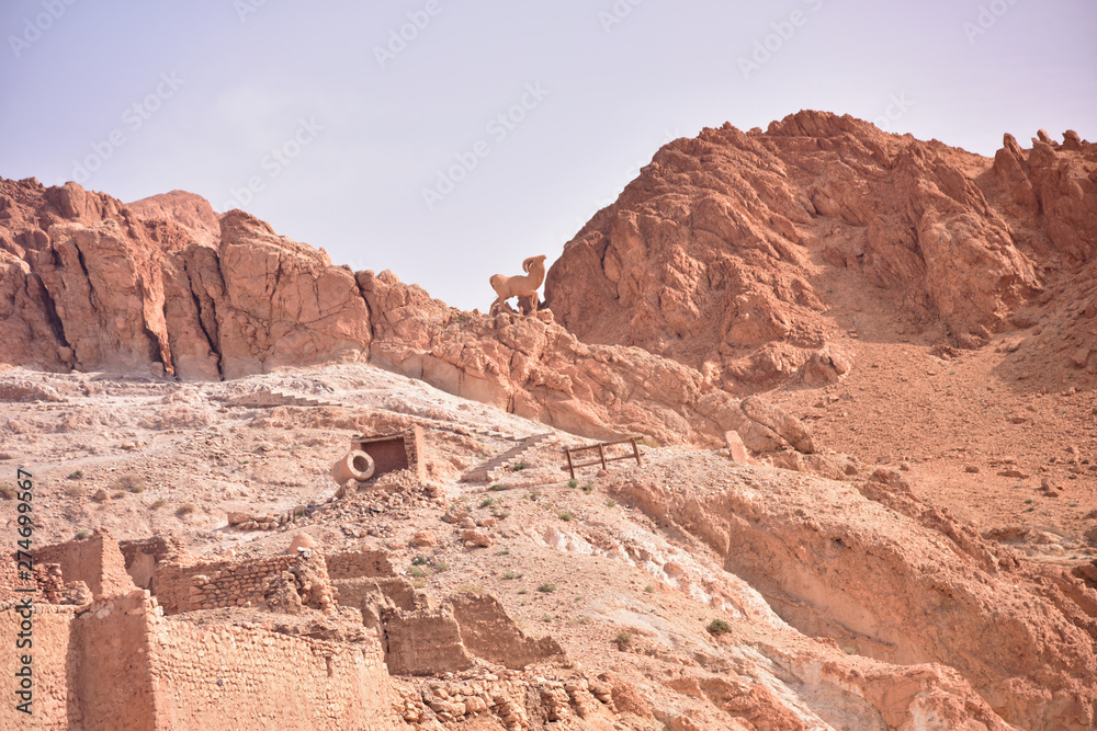 CHEBIKA, TN - JULY, 2019: Chebika Oasis lies at the foot of the mountains of the Djebel el Negueb and it is known as Qasr el-Shams (Castle of the Sun in Arabic).