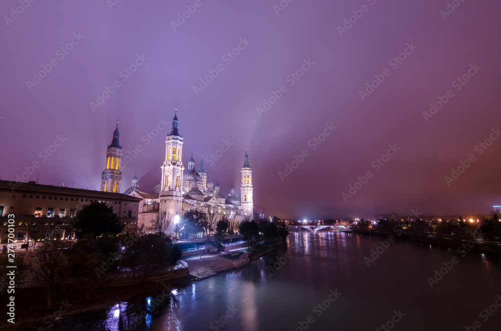 Night view of the Basilica of Our Lady of the Pillar, Zaragoza, Spain.