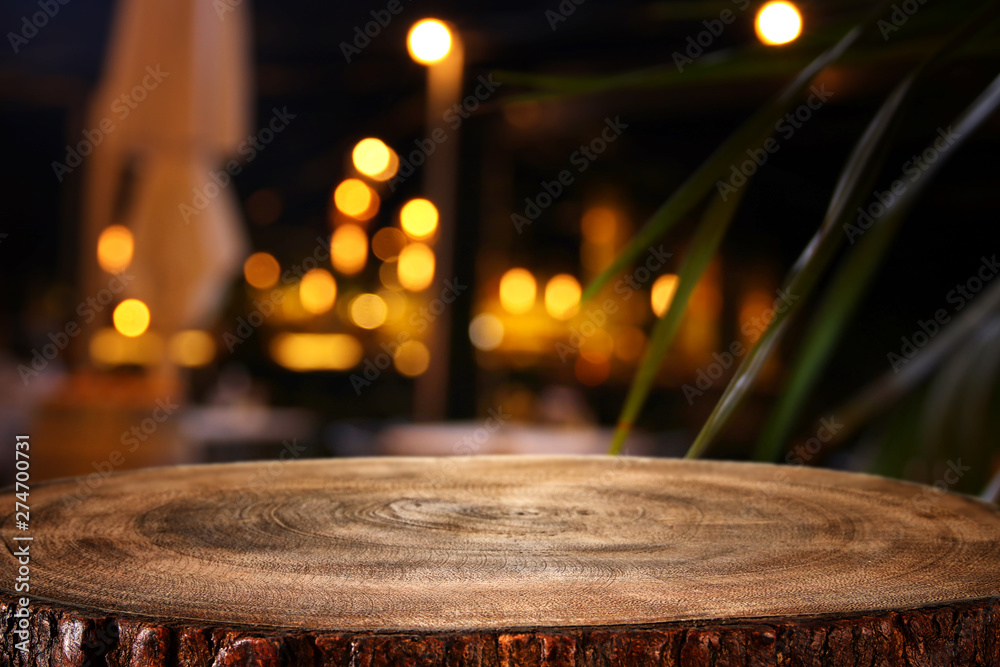 background of wooden table in front of abstract blurred restaurant lights  Stock Photo | Adobe Stock