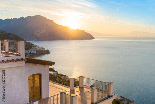 Beautiful sunrise over Amalfi town on Italian coast, Italy