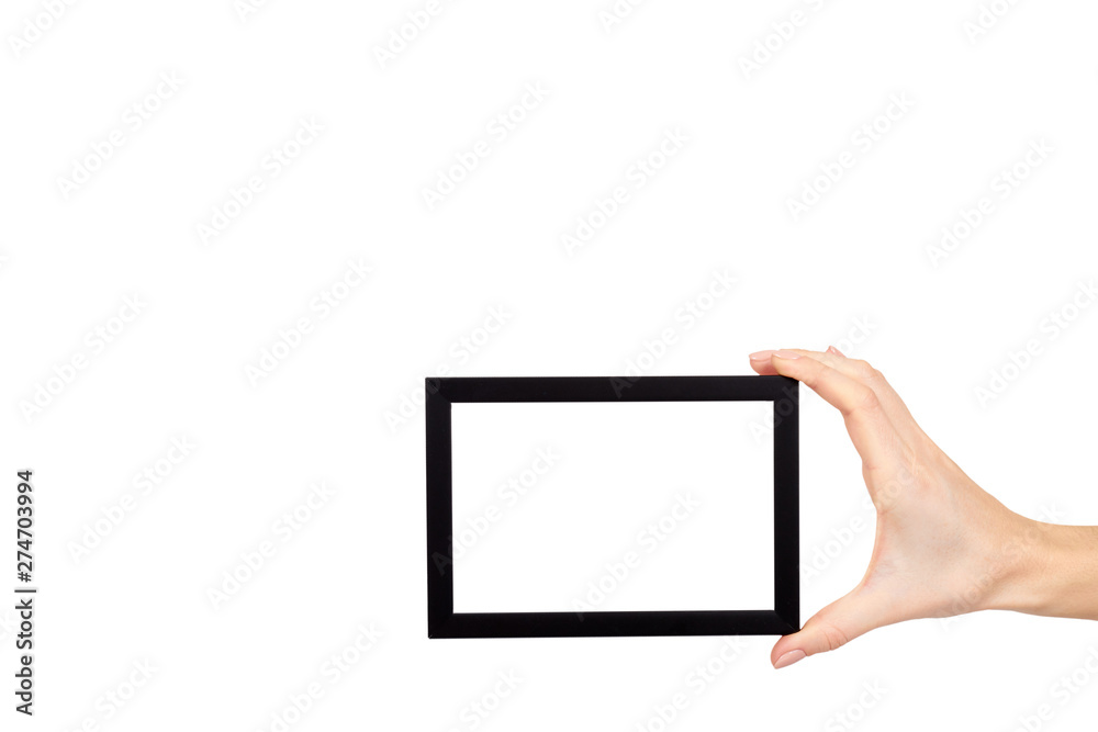 Hand with black wooden frame for photo, copy space template. Hand with black wooden frame for photo, copy space template.