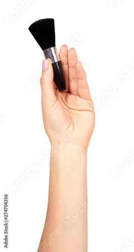 Hand with black eye makeup brush. Isolated