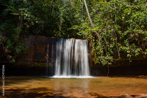 Waterfall in nature with native vegetation refers to healthy life. © Rogerio