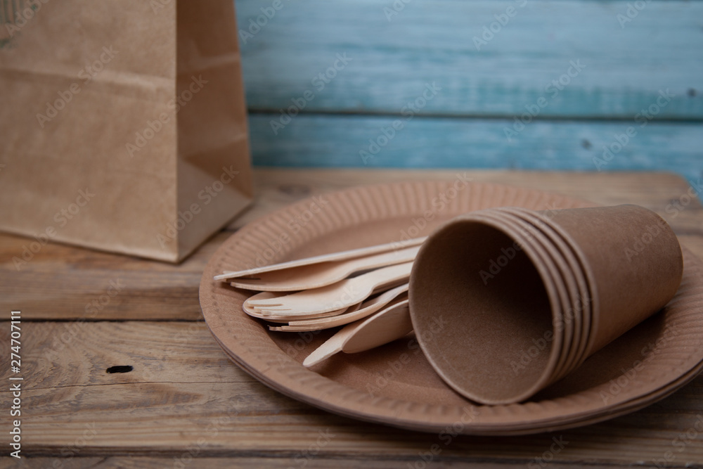eco paper plate dish fork on old wooden table eco paper plate dish fork on old wooden table