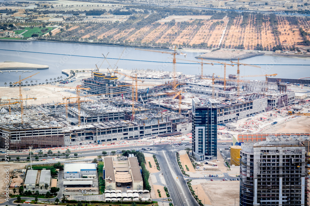 Aerial shot of a Construction site, tools, crane - a new mall under construction - Al Reem Mall