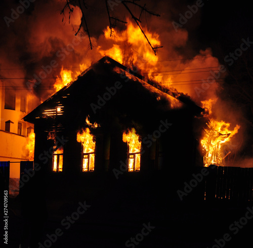 An old Wooden house burning