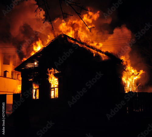 An old Wooden house burning