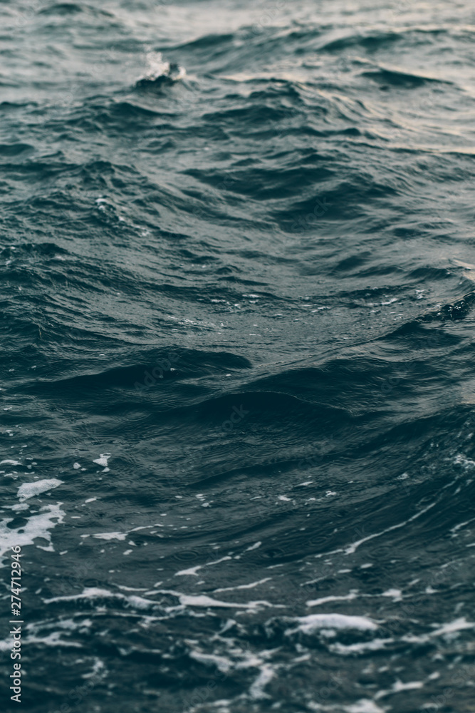 Fototapeta premium dark blue sea water background, shades of blue in black sea