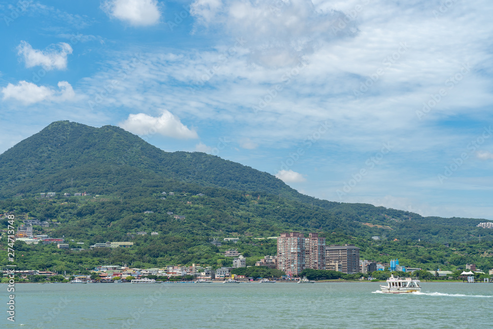 Fototapeta premium Tamsui is a sea-side district in New Taipei, Taiwan. The town is popular as a site for viewing the sun setting into the Taiwan Strait.