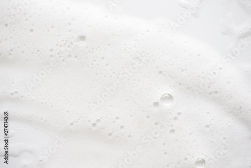 Abstract background white soapy foam texture. Shampoo foam with bubbles photo