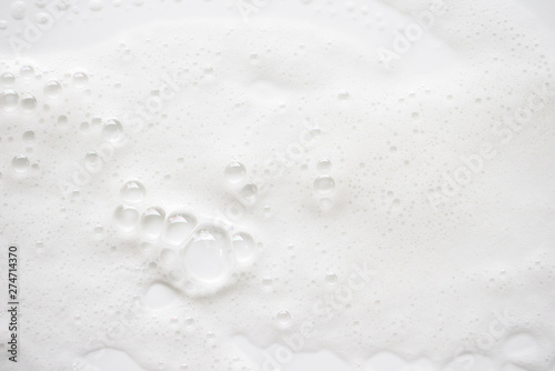 Abstract background white soapy foam texture. Shampoo foam with bubbles