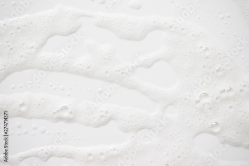Abstract background white soapy foam texture. Shampoo foam with bubbles