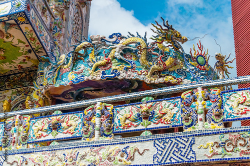 Colorful mosaic of porcelain in shape of dragon in ancient temple in Dalat Vietnam