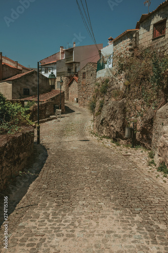 Narrow deserted alley and old houses © Celli07