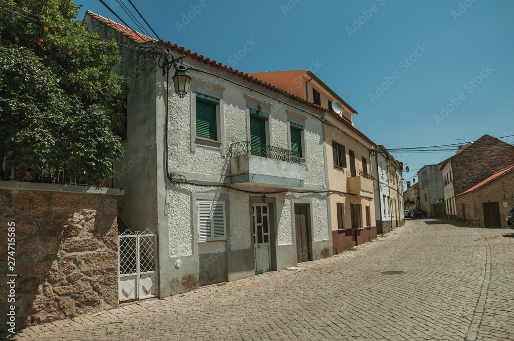 House with large balcony on deserted alley House with large balcony on deserted alley
