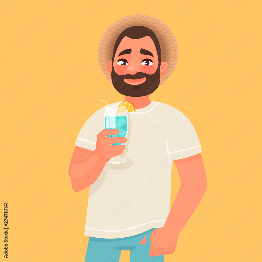 Smiling man with a hat and a cocktail in his hand. The concept of a carefree summer holiday and travel to the southern countries
