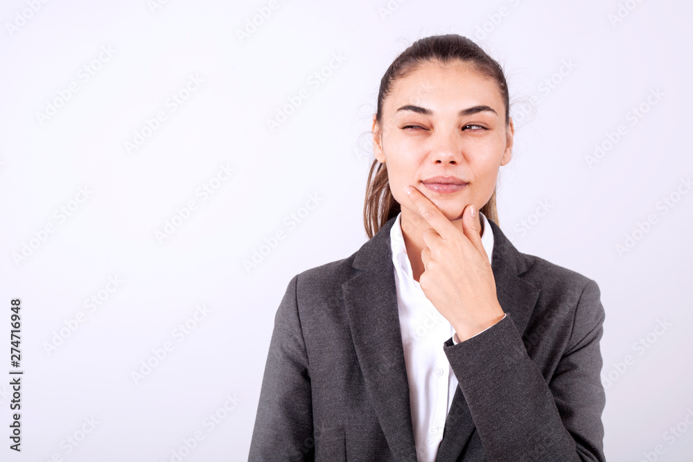 young woman standing over grey grunge wall crazy and mad shouting and yelling with aggressive expression and arms raised. Frustration young woman standing over grey grunge wall crazy and mad shouting and yelling with aggressive expression and arms raised. Frustration
