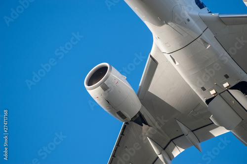 Closeup of an aircraft fuselage, turbofan and a wing