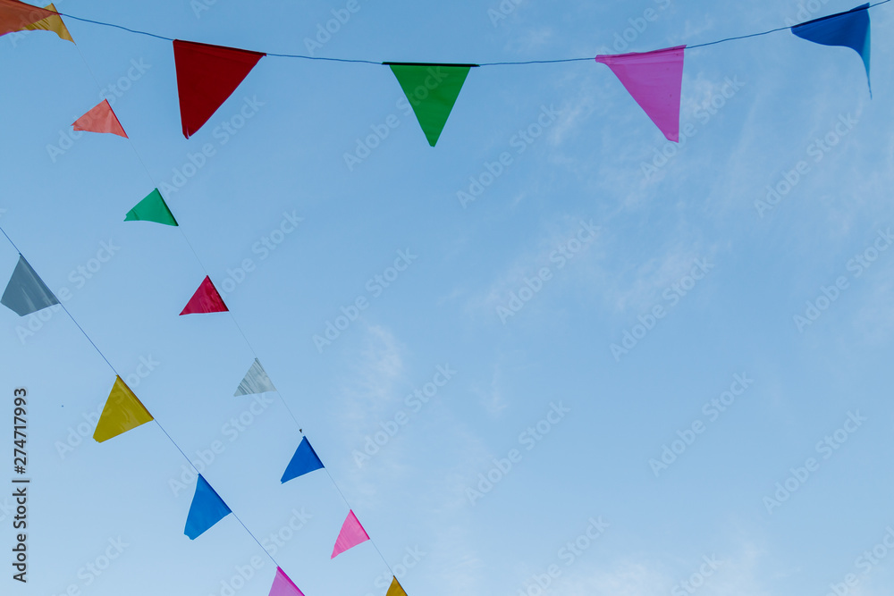 Fototapeta premium festival flag line with blue sky in background