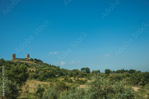 Hilly landscape with the towers of castle