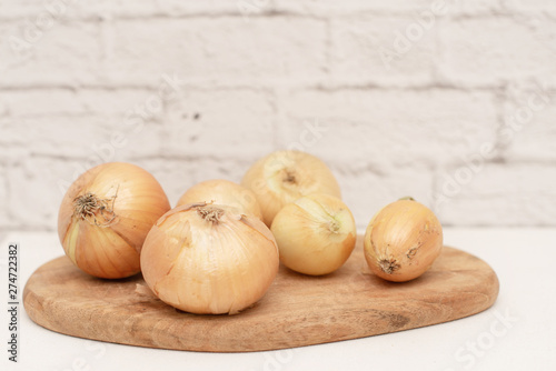 fresh onions on a wooden board