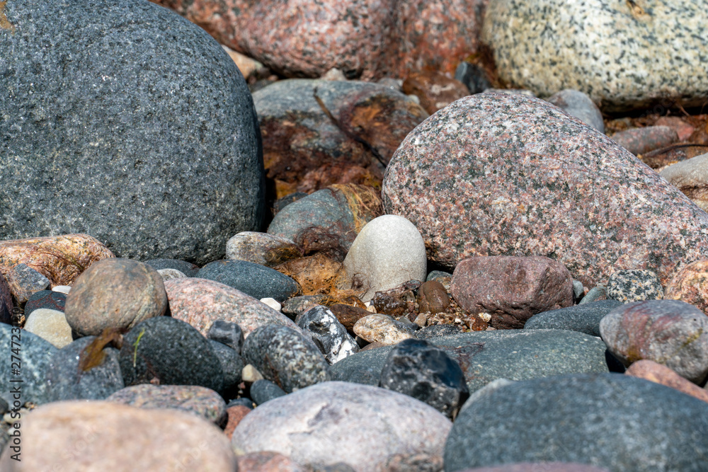 Multi coloured pebbles on a beach Multi coloured pebbles on a beach