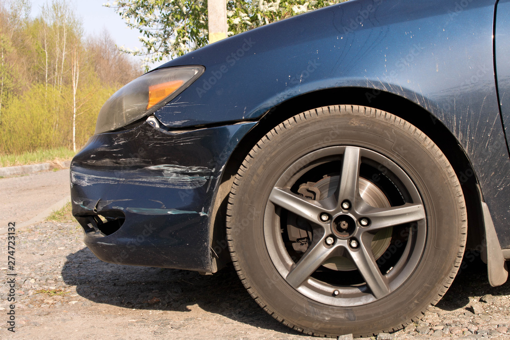 Damaged car. Broken front bumper. The concept of road safety. Close up. Damaged car. Broken front bumper. The concept of road safety. Close up.
