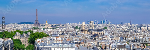 Paris  typical roofs  aerial view with the Eiffel Tower and the Saint-Sulpice church in background 