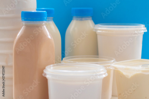 different milk products on blue background