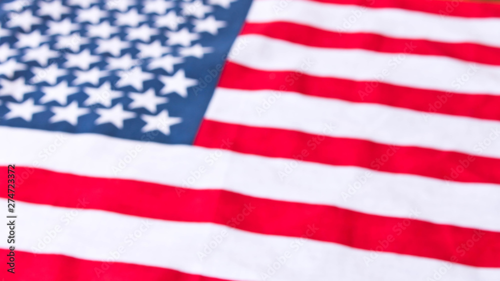 Obraz premium American flag. Close up. American flag blurred background. Concept of patriotism.