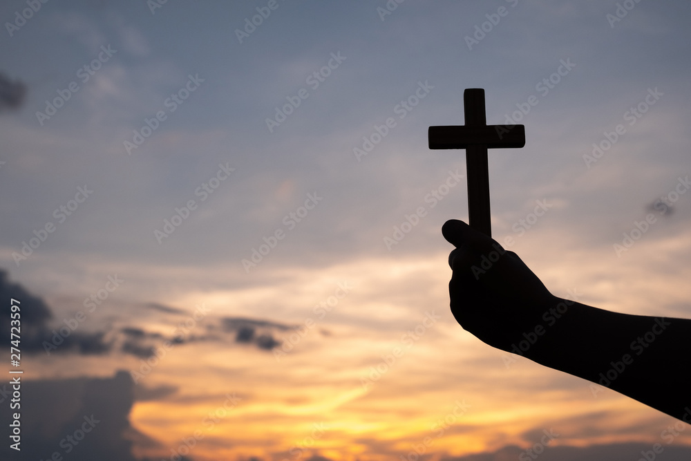 The hand holding the cross.The symbol of the blessing of Jesus.A symbol of pleading and faith.The symbol of the cross with the sunshine in the sky. Have space to enter text.