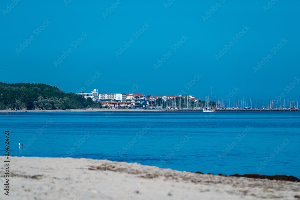 Obraz premium Kuehlungsborn village and harbour seen across the ocean