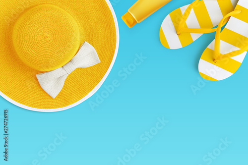 Top view of summer beach yellow accessories on blue backgroundsea holiday vacation and travel concept photo