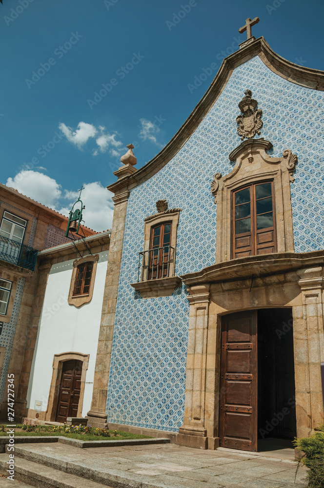 Facade covered by ceramic tiles in a baroque Church Facade covered by ceramic tiles in a baroque Church