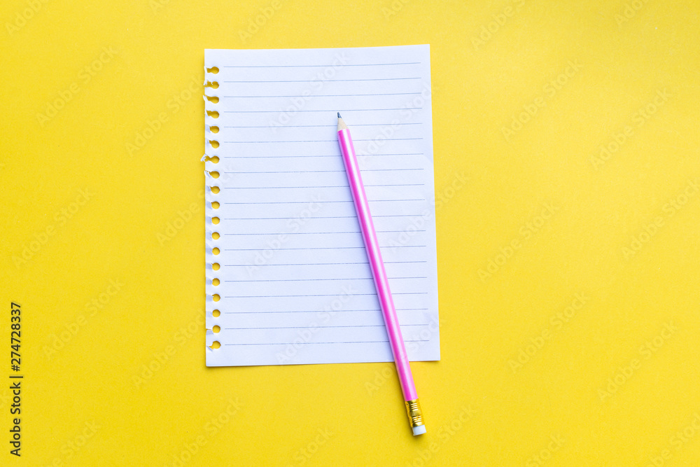 empty notebook with on yellow background. empty notebook with on yellow background.