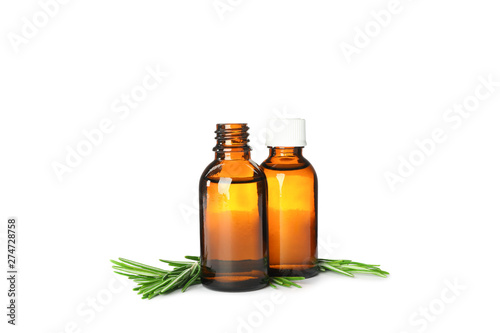 Rosemary oil in jars isolated on white background