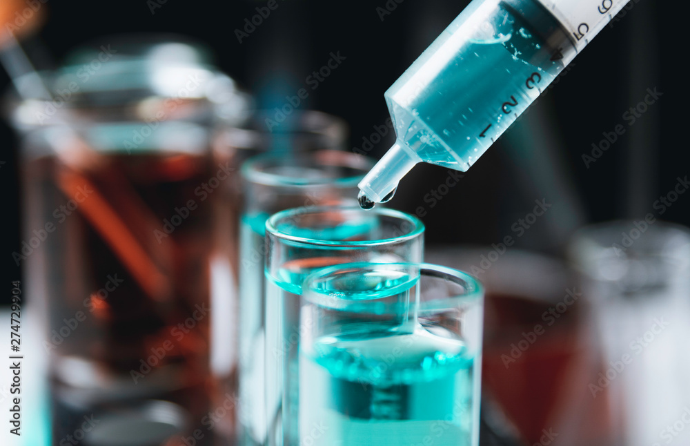 Glass laboratory chemical test tubes with liquid for analytical , medical, pharmaceutical and scientific research concept. Glass laboratory chemical test tubes with liquid for analytical , medical, pharmaceutical and scientific research concept.